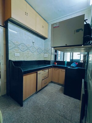 Kitchen in 2 BHK Apartment at Satya Jivan CHS, Lbs Marg – for Rent