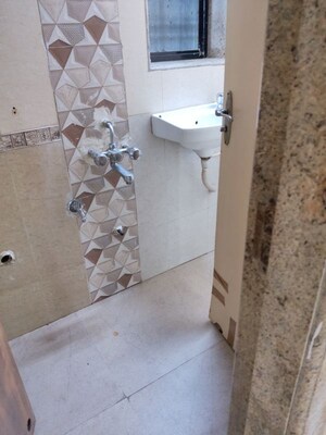 Bathroom in 2 BHK Apartment at Oshiwara Mayfair Apartment, Andheri West – for Rent