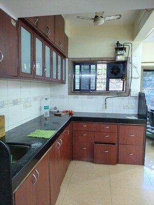Kitchen in 2 BHK Apartment at Oshiwara Mayfair Apartment, Andheri West – for Rent