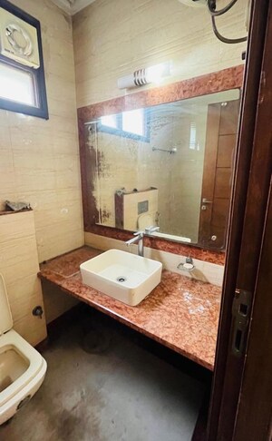 Bathroom in 2 BHK Builder Floor at Kalkaji – for Rent