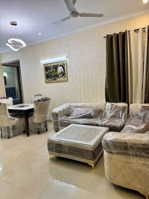 Living Room in 2 BHK Apartment at Affinity Greens, International Airport Road – for Rent