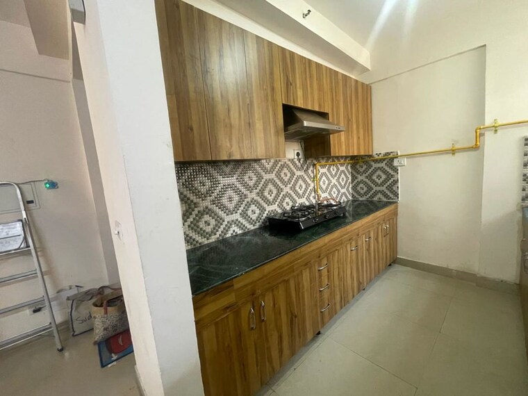 Kitchen, jaypee-green-kosmos-phase-ii 3 Bedroom 1370 Sq.Ft. Builder Floor In Sector 134 Noida 10450500