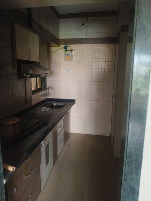 Kitchen in 2.5 BHK Apartment at Wadhwa Meadows, Khadakpada – for Sale