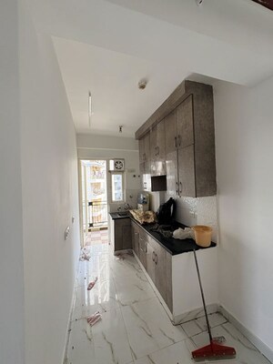 Kitchen in 2 BHK Apartment at Casa Woodstock, Sector 16c Greater Noida – for Sale