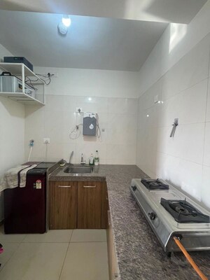 Kitchen in 1 BHK Apartment at Ahura Pearl Suites, Mundhwa – for Rent