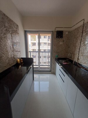 Kitchen in 2 BHK Apartment at Raunak Residency Thane, Pokhran Road No One – for Rent