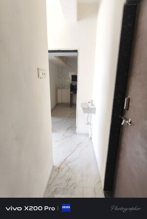 Building Lobby in 1 BHK Apartment at Wadgaon Sheri – for Rent