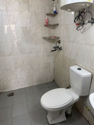 Bathroom in 2 BHK Apartment at Aims Golf City, Sector 75 – for Rent