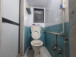 Bathroom in 3 BHK Apartment at Topiwala CHS, Goregaon West – for Rent