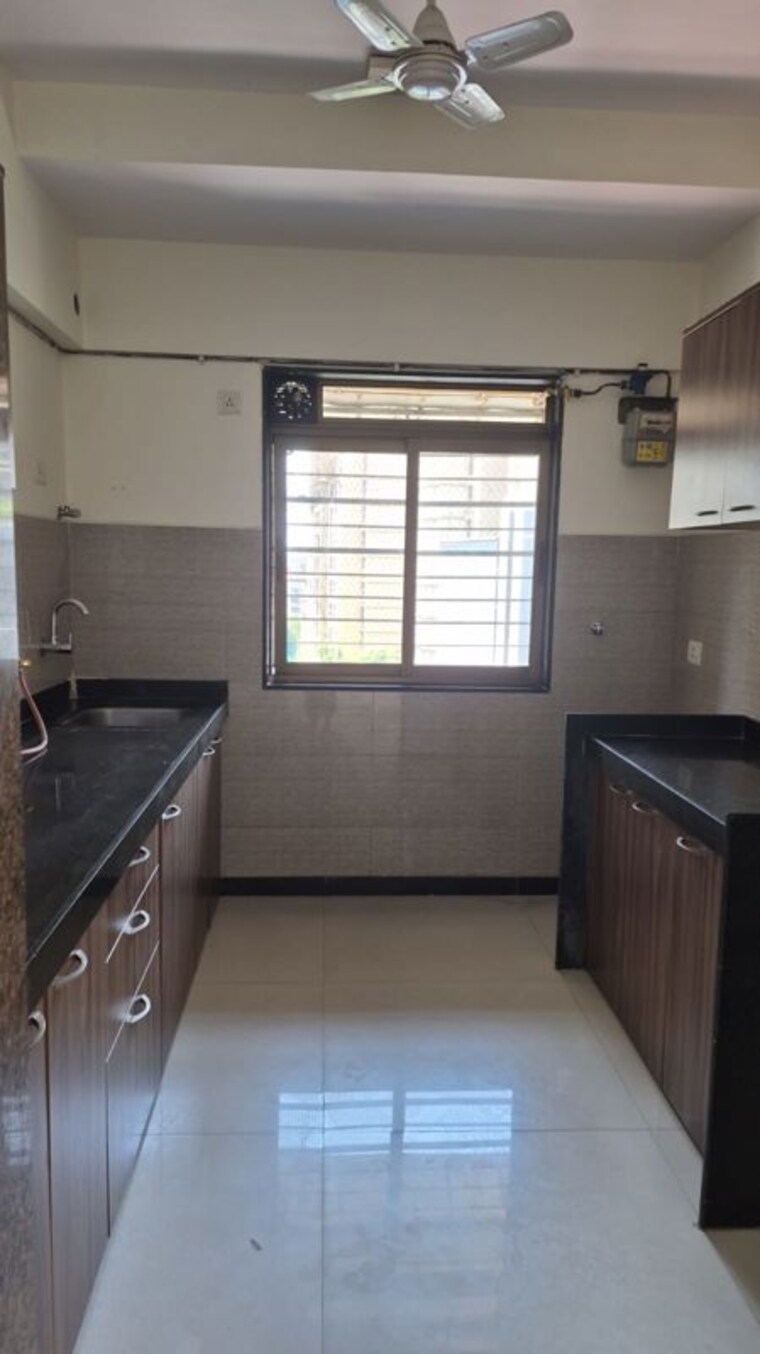 Kitchen, acme-alpinia 2 Bedroom 700 Sq.Ft. Apartment In Ghodbunder Road Thane 10452106