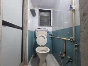 Bathroom in 3 BHK Apartment at Topiwala CHS, Goregaon West – for Rent