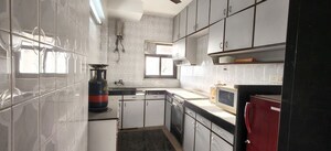 Kitchen in 2 BHK Apartment at Magnum Tower CHS, Andheri West – for Sale