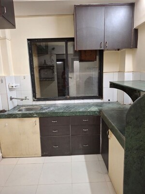 Kitchen in 1 BHK Apartment at RNA NG Regency Phase I, Balkum Pada – for Sale
