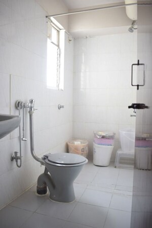 Bathroom in 4 BHK Apartment at Sadhu Vasvani Nagar – for Rent