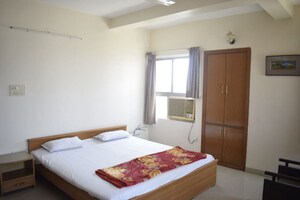 Bedroom in 4 BHK Apartment at Sadhu Vasvani Nagar – for Rent