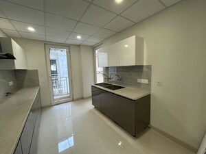 Kitchen in 3 BHK Apartment at Motia Blue Ridge, Dhakoli – for Sale