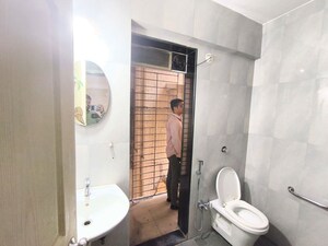 Bathroom in 2 BHK Apartment at Naupada – for Rent