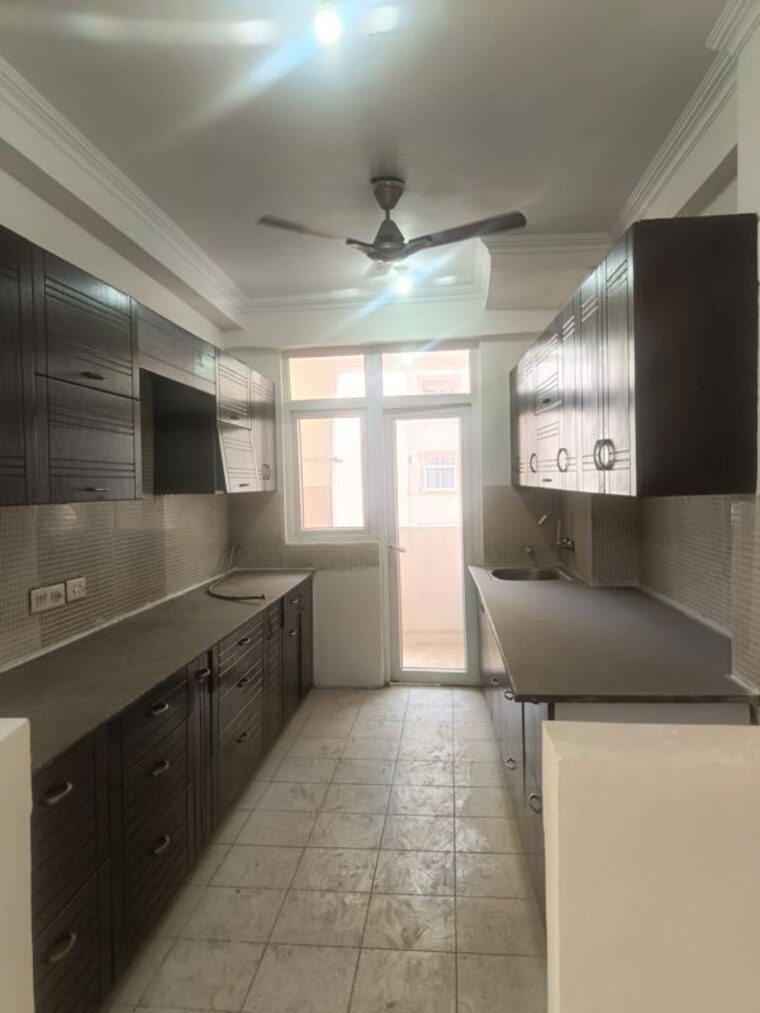 Kitchen, amrapali-silicon-city 4 Bedroom 2410 Sq.Ft. Apartment In Sector 76 Noida 10453625