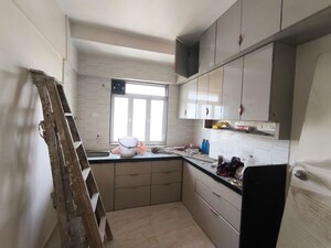 Kitchen in 2 BHK Apartment at Yash Satyaneelayam CHS, Naupada – for Rent