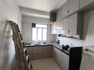 Kitchen in 2 BHK Apartment at Yash Satyaneelayam CHS, Naupada – for Rent