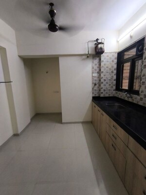 Kitchen in 2 BHK Apartment at Yash Satyaneelayam CHS, Naupada – for Rent