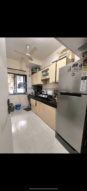 Kitchen in 2 BHK Apartment at K Raheja Palm Court J Building, Malad West – for Rent