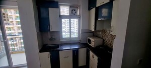 Kitchen in 2 BHK Apartment at Panchsheel Greens, Sector 16 Greater Noida – for Rent