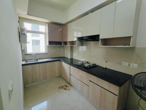 Kitchen in 2.5 BHK Apartment at Smart World Orchard, Sector 61 – for Rent