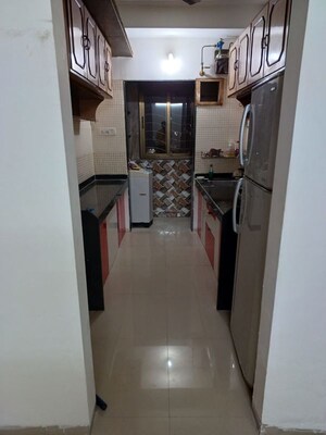 Kitchen in 2 BHK Apartment at Sudarshan Sky Garden, Ghodbunder Road – for Sale