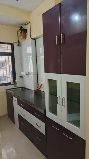 Kitchen in 1 BHK Apartment at Unnathi Woods Phase 1 And 2, Ghodbunder Road – for Rent