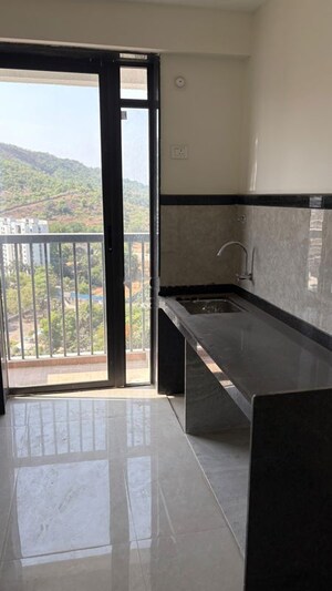 Kitchen in 2 BHK Apartment at Dhamji Shamji Mahavir Spring Tulip Phase 1, Pokhran Road No Two – for Rent