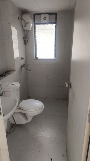 Bathroom in 1 BHK Apartment at Runwal Gardens, Dombivli East – for Rent