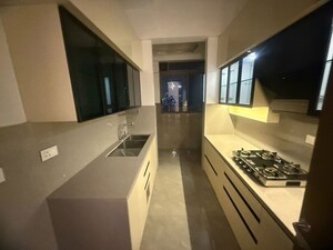 Kitchen in 3 BHK Apartment at Ruparel Ariana, Parel – for Rent