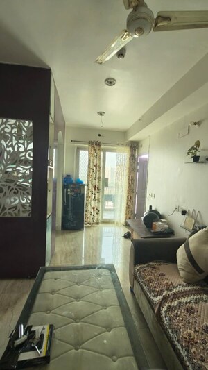 Living Room in 2 BHK Apartment at Mahaluxmi Migsun Ultimo, Omicron Iii Greater Noida – for Rent