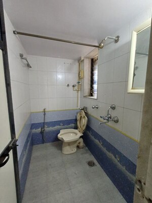 Bathroom in 2 BHK Apartment at Grandeur Giriraj Jewel, Talav Pali – for Rent