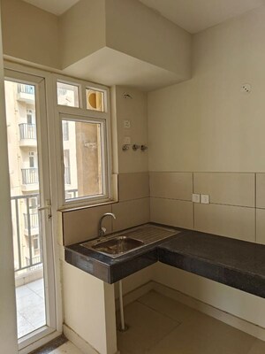 Kitchen in 3.5 BHK Apartment at Tata Eureka Park, Sector 150 – for Rent
