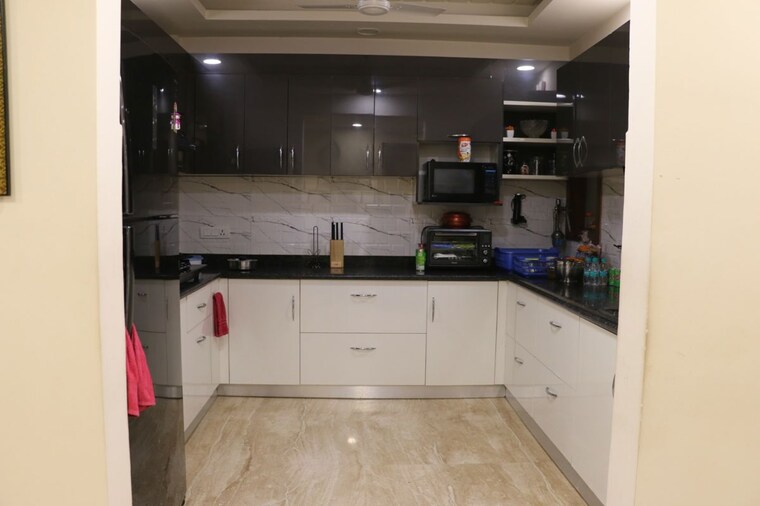 Kitchen, malibu town 4 Bedroom 250 Sq.Yd. Builder Floor In Malibu Town Gurgaon 10457124