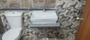 Bathroom in 2 BHK Apartment at Shri Radha Sky Gardens, Sector 16b Greater Noida – for Rent