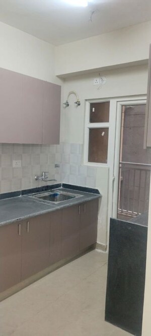 Kitchen in 2 BHK Apartment at Shri Radha Sky Gardens, Sector 16b Greater Noida – for Rent