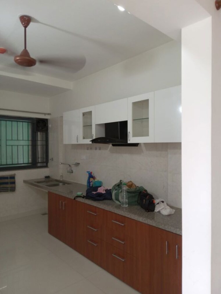 Kitchen, kumar-palmspring-towers 2 Bedroom 950 Sq.Ft. Apartment In Undri Pune 10458036