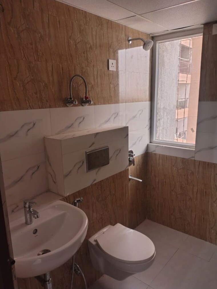 Bathroom, amrapali-zodiac 2.5 Bedroom 1075 Sq.Ft. Apartment In Sector 120 Noida 10458195