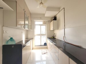 Kitchen in 1.5 BHK Apartment at Godrej Emerald, Ghodbunder Road – for Rent