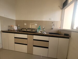 Kitchen in 1 BHK Apartment at Puraniks City Reserva, Ghodbunder Road – for Rent