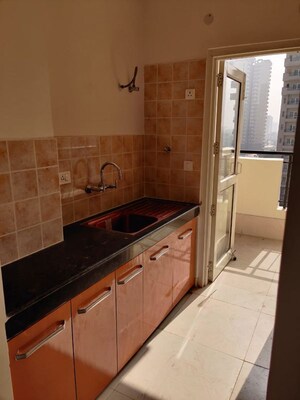 Kitchen in 2 BHK Apartment at AWHO Shanti Vihar, Sector 95 – for Rent