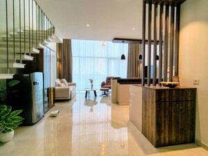 Living Room in Studio Apartment at M3M Corner Walk, Sector 74 – for Rent