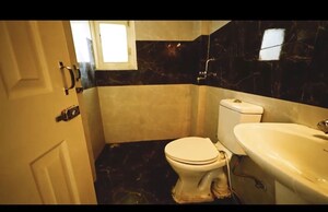 Bathroom in 2 BHK Apartment at Gulmohur Garden, Raj Nagar Extension – for Sale