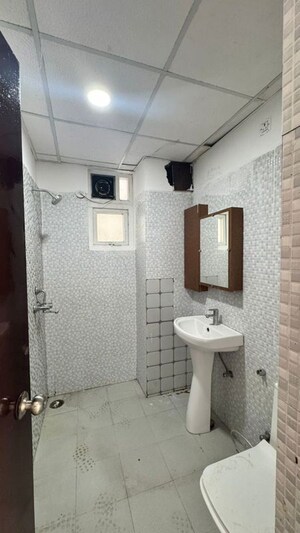 Bathroom in 2 BHK Apartment at Urban Axis Urban Woods, Sushant Golf City – for Rent
