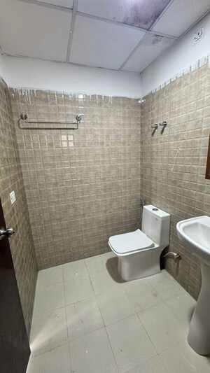 Bathroom in 2 BHK Apartment at Urban Axis Urban Woods, Sushant Golf City – for Rent
