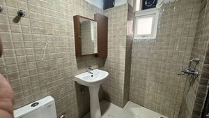 Bathroom in 2 BHK Apartment at Urban Axis Urban Woods, Sushant Golf City – for Rent