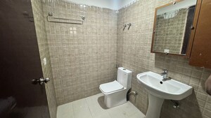 Bathroom in 2 BHK Apartment at Urban Axis Urban Woods, Sushant Golf City – for Rent